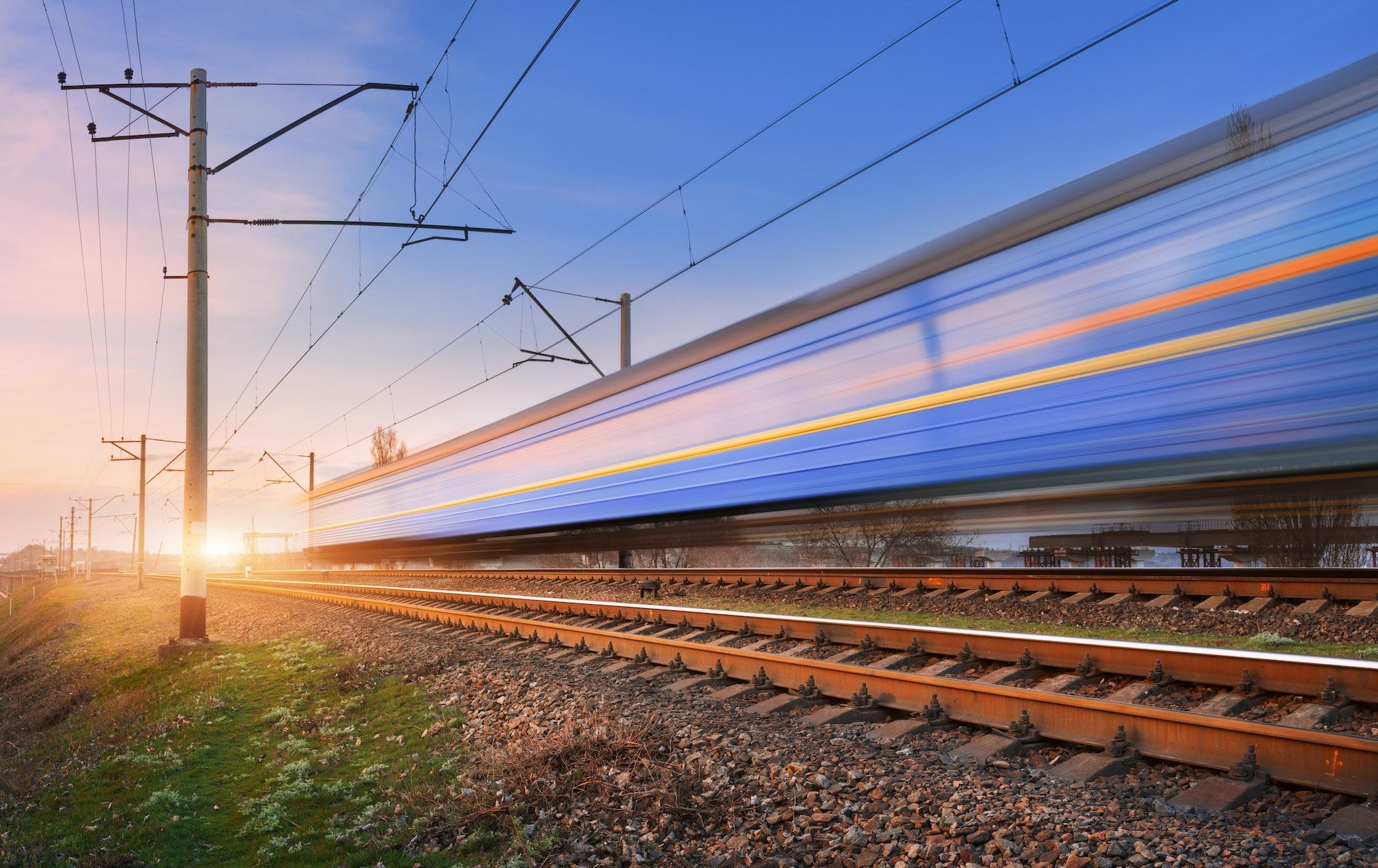 High speed passenger train in motion on railroad